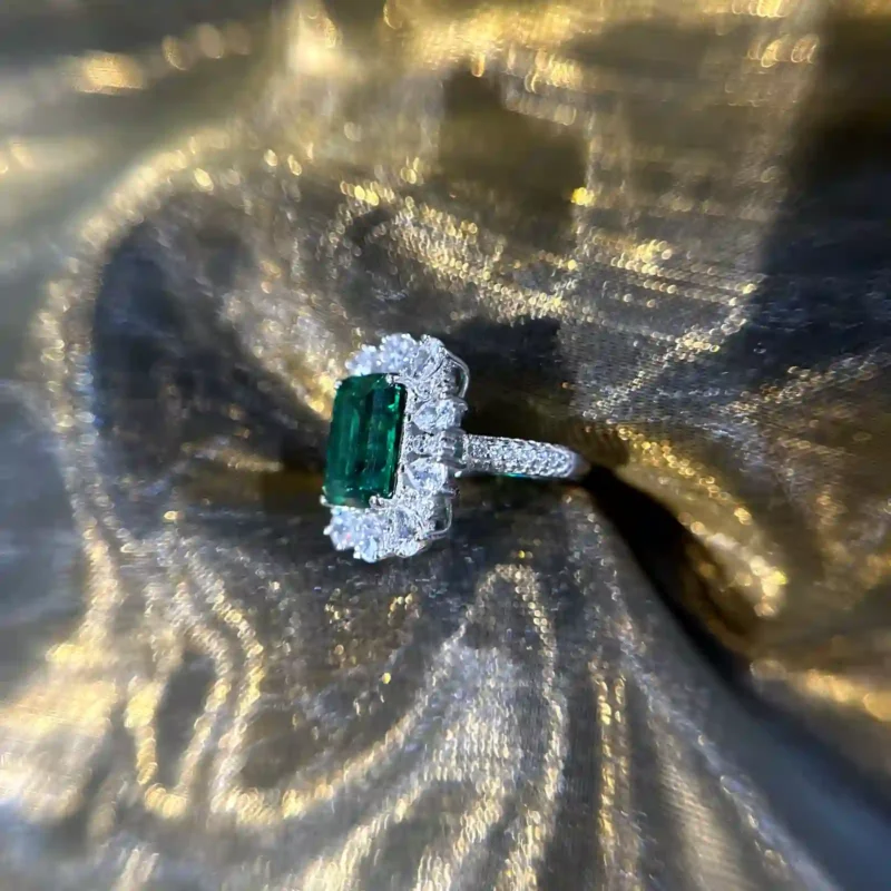 Classic Emerald with Side Diamonds Ring