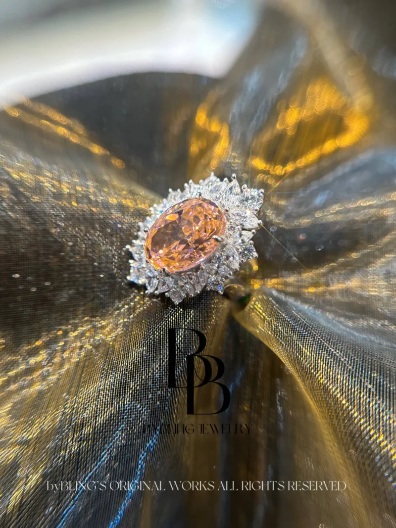 The Oval-Shaped Padparadscha and Diamond Ring