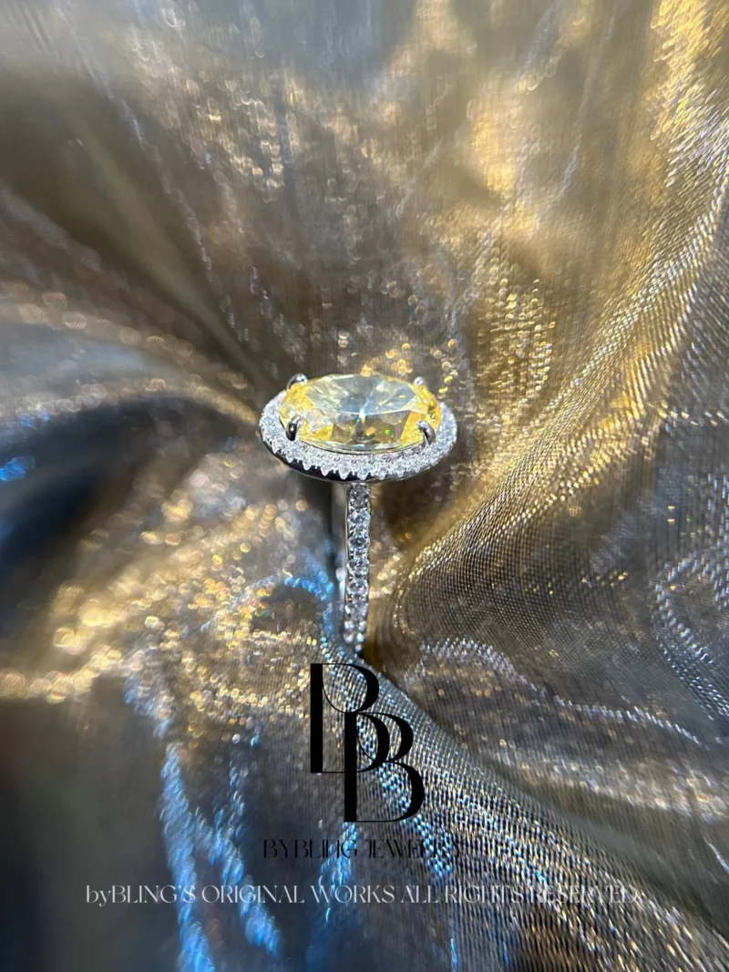 The oval-shaped yellow diamond and diamond ring