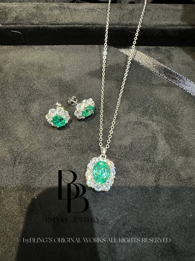 The oval-shaped green tourmaline and diamond pendant
